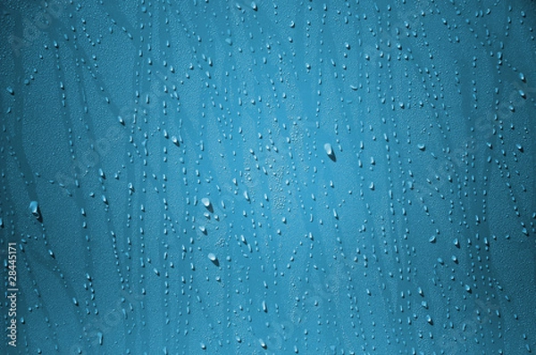 Obraz Water drop on the blue wall