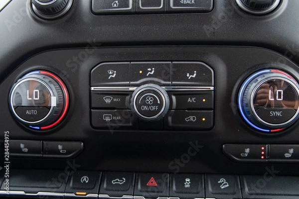 Fototapeta Close up of dusty control panel of a new vehicle