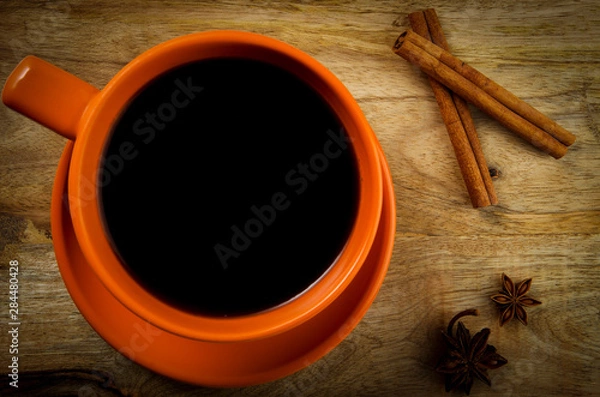 Obraz Cup of drink on a wooden background. View from above.