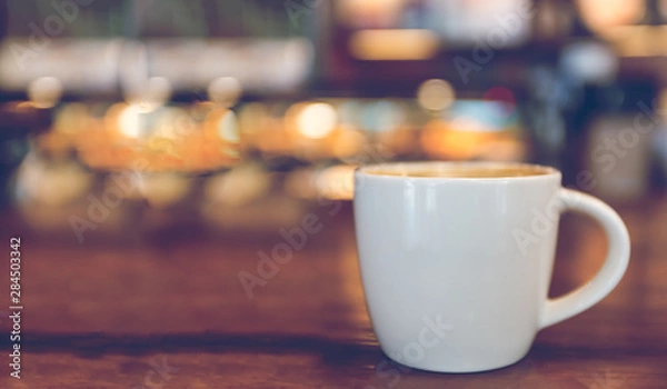 Fototapeta Hot coffee in the cafe is placed on the table. With space for text input