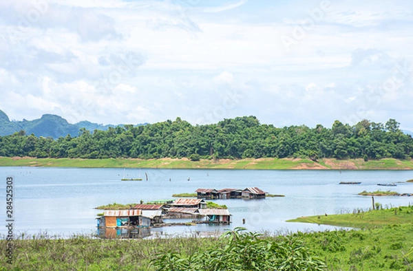 Fototapeta The wooden raft on the water in reservoirs and mountain views at Khao Laem National Park ,Kanchanaburi in Thailand.
