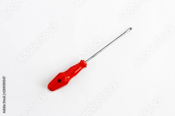 Obraz old rusty metal screwdriver for screws with red handle