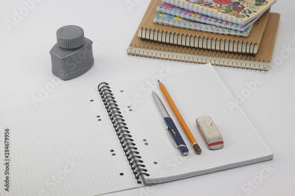 Obraz Ballpoint pen with notebook on white table