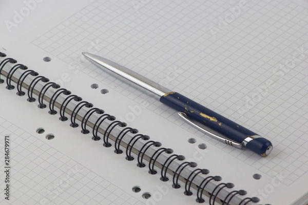 Obraz Ballpoint pen with notebook on white table