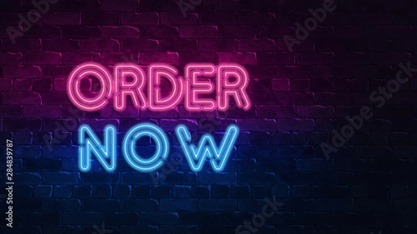 Fototapeta order now neon sign. purple and blue glow. neon text. Brick wall lit by neon lamps. Night lighting on the wall. 3d illustration. Trendy Design. light banner, bright advertisement