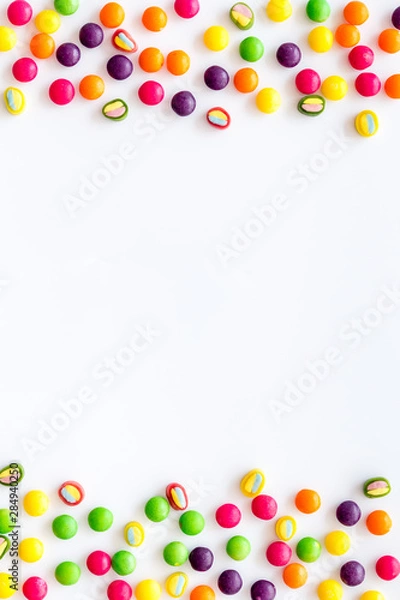 Obraz Candies frame for party design on white background top view copyspace