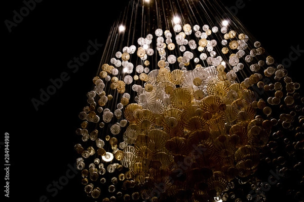 Obraz Abstract shot of a chandelier made up of smaller globes illuminated from above