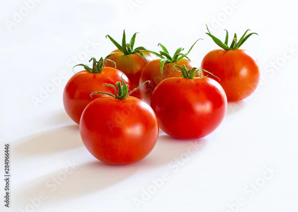 Fototapeta small red cherry tomatoes on white background