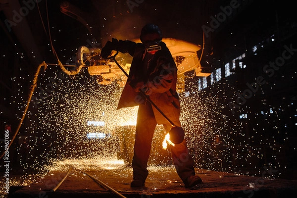 Obraz Steelmaker at ingot casting. Electric arc furnace shop EAF. Metallurgy.