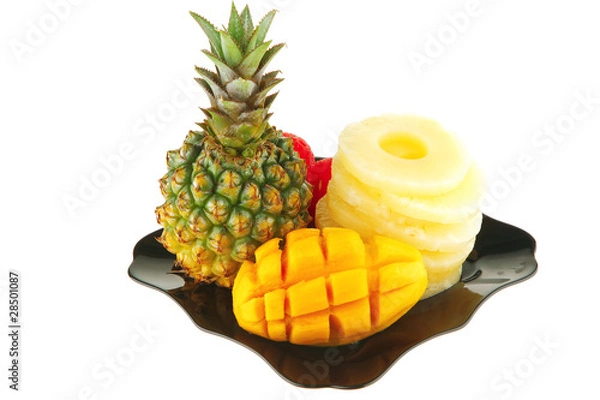 Fototapeta tropical fruits served on black
