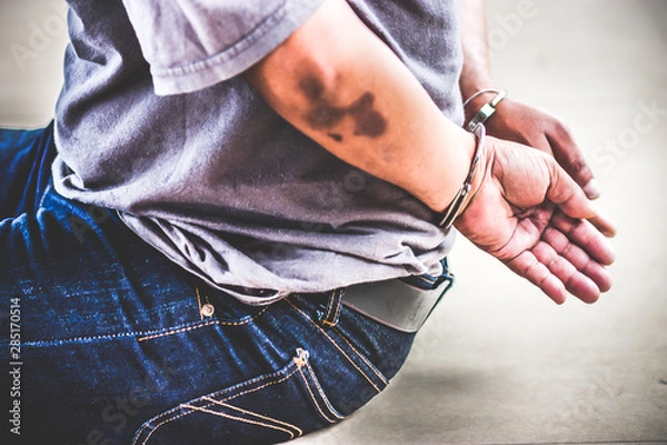 Obraz Handcuffs on hands