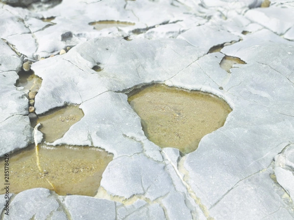 Obraz weathered rocks and sand background