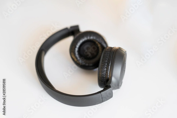 Fototapeta black headphones on a white background on the table