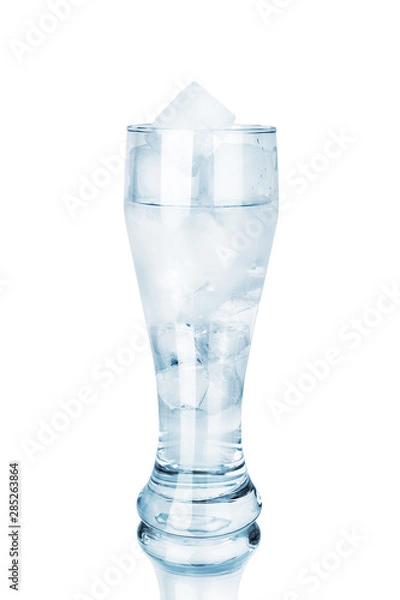 Fototapeta One full transparent glass of cool crystal clear water and ice cubes with mirror reflection on white background isolated closeup, blue cup of cold mineral icy water design, natural fresh drink concept