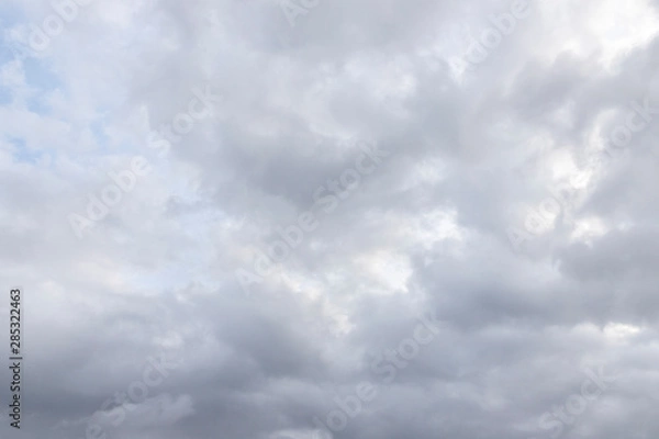 Fototapeta The sky is overcast. You can see light and dark clouds. Cloudy weather before the rain. Textural background with free space and empty space.