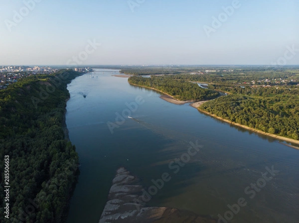 Fototapeta Aerial view of big siberian Ob river and ship, summer day, drone shot