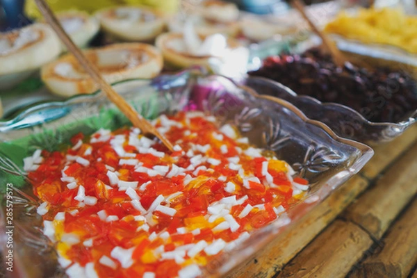 Fototapeta Ice cream made from coconut Put in a container from coconut. Looks good.