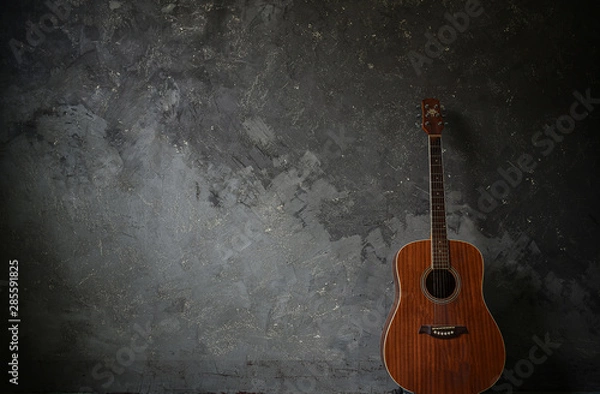 Obraz Guitar on a cement background
