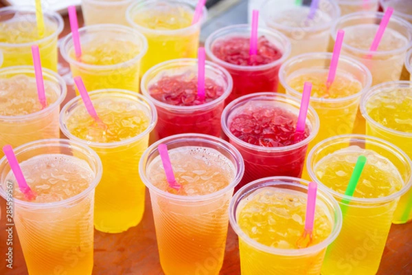Obraz Colorful soft drink in plastic cup
