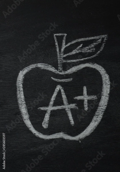 Fototapeta A Plus grad mark with apple 