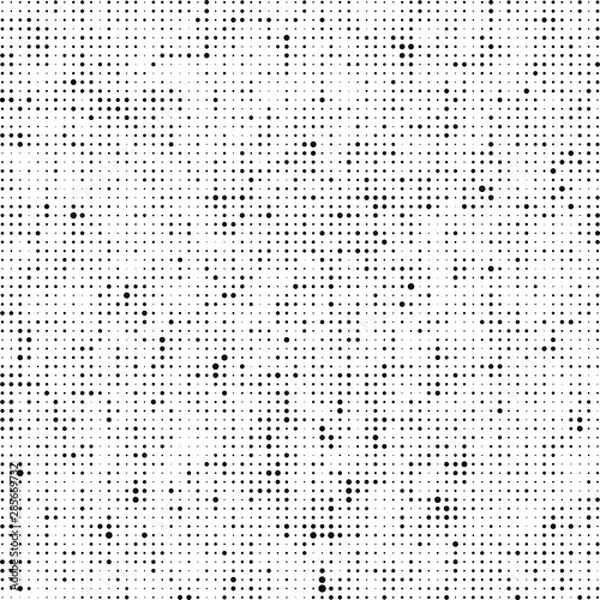 Fototapeta Abstract halftone texture. Chaotic background of black dots on white