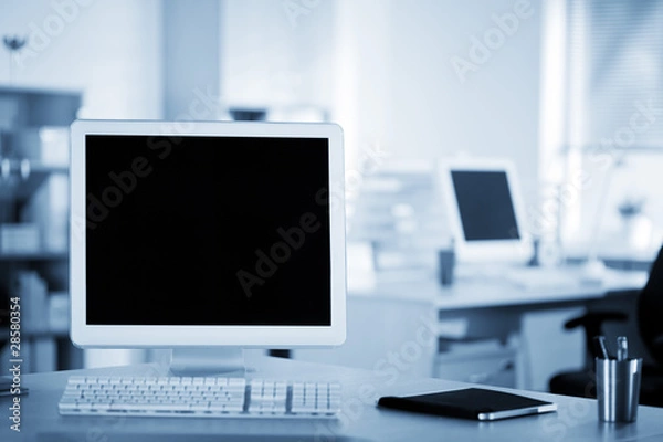 Obraz Computer and notebook on the working place in the office