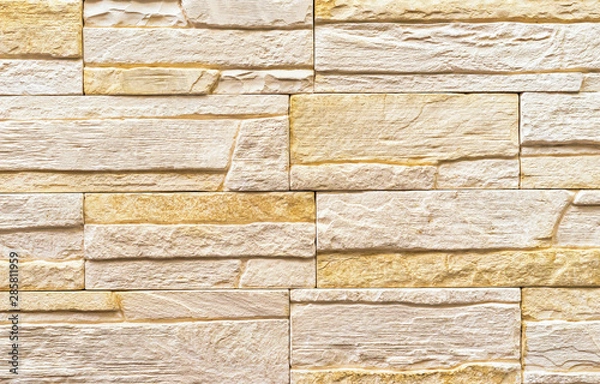 Fototapeta Texture of the stone wall. Panel of stones for finishing the facade of the building and interior design of the house.