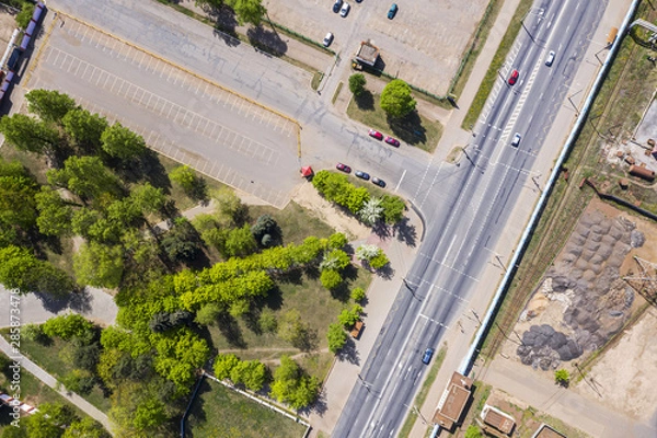 Fototapeta aerial top view of industrial district. parking near manufacturing company