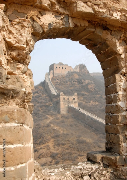 Fototapeta The Great Wall of China. This section of the Great Wall is Jinshanling, a wild part with scenic views. The Great Wall of China near Beijing. Wild Great Wall of China, Jinshanling, Beijing, window view
