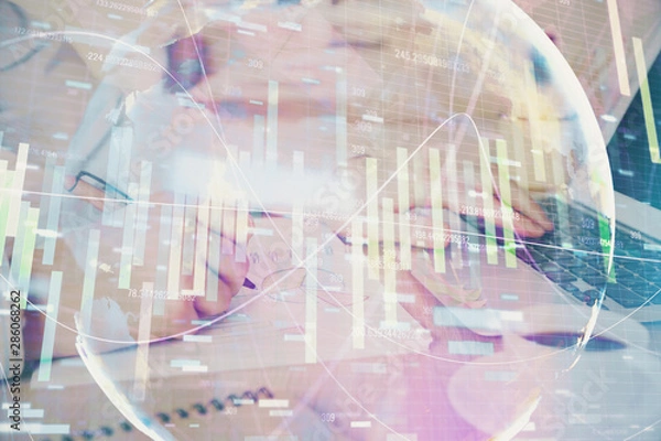 Fototapeta Multi exposure of businessman working on laptop on background. International business hologram in front. Concept of success.