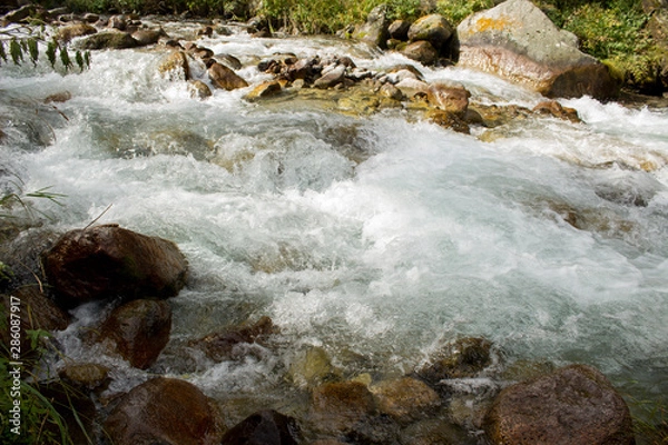 Obraz water flowing over rocks