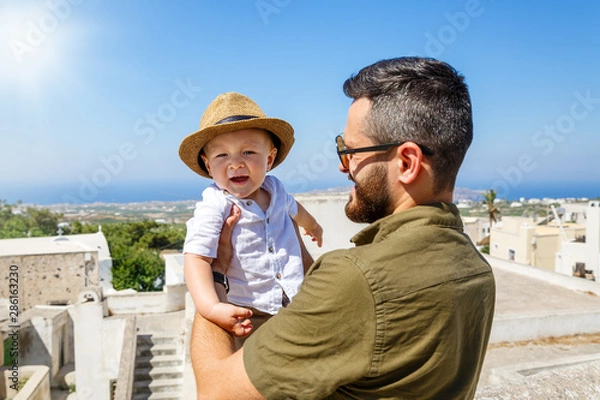Fototapeta Father and little son on Santorini