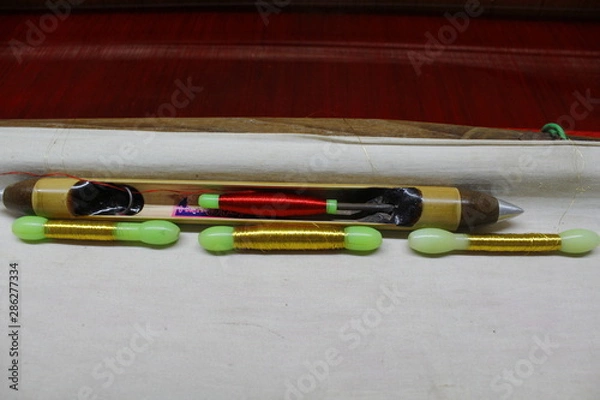 Obraz Hand loom silk sarees weaving process with gold thread