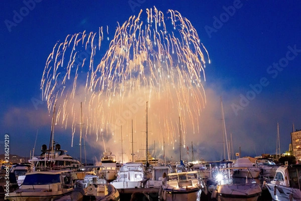 Fototapeta Panoramic lovely view of fireworks on the Principality of Monaco on a stormy day