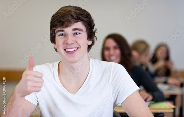 Fototapeta Happy Student has fun while working in classroom