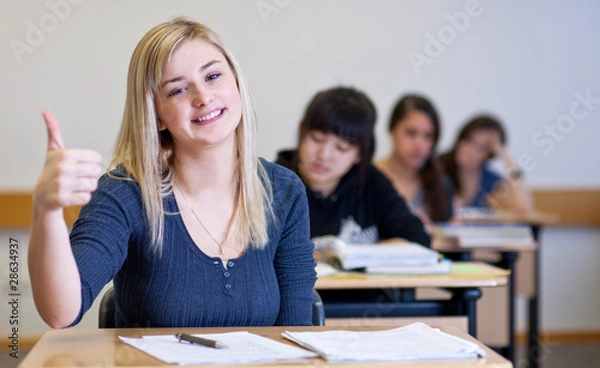 Fototapeta Happy Student has fun while working in classroom