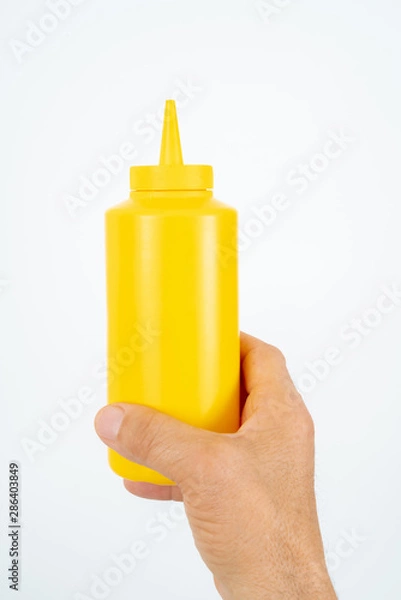 Obraz hand holding plastic ketchup box