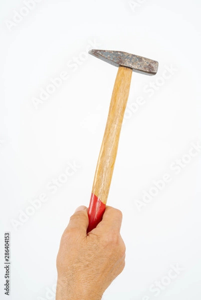 Obraz man hand holding hammer.