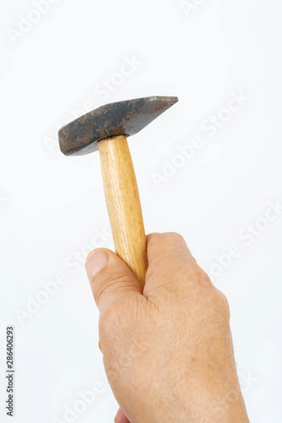 Obraz man hand holding hammer.
