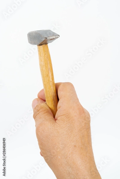 Obraz man hand holding hammer.