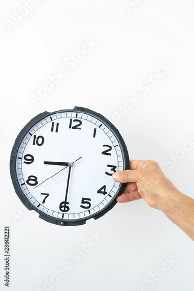 Obraz man hand holding clock