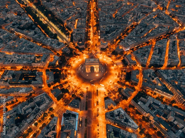 Fototapeta Aerial of the Arc de Triomphe in Paris, France at night