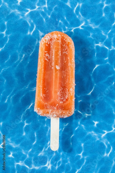 Obraz tasty and refreshing Popsicle  with flavor tangerine.