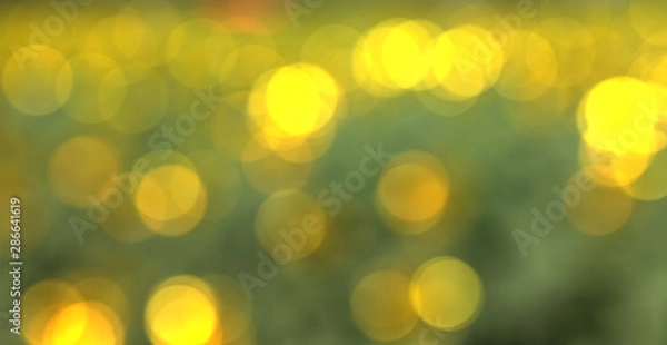 Obraz Bright yellow bokeh background, colourful dot pattern. 