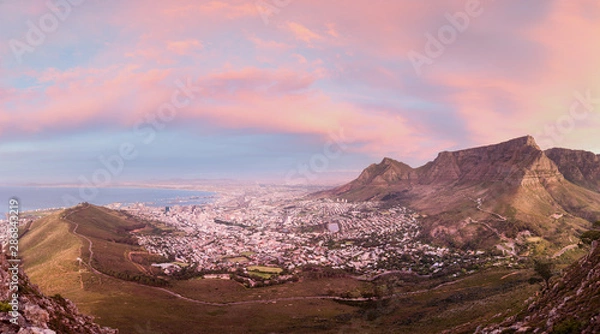 Obraz Moody Table Mountain after sunset with city lights as seen from Lions Head.