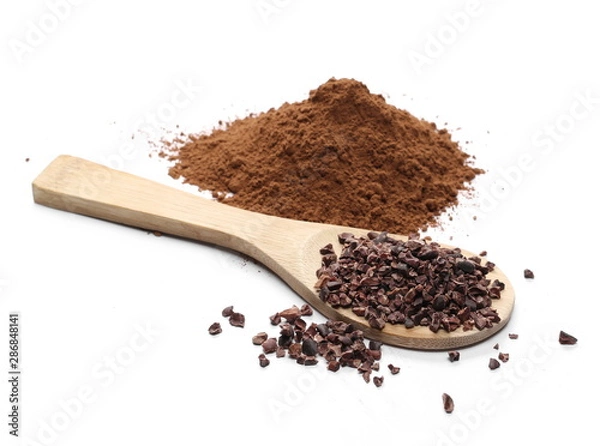 Fototapeta Chopped and powder cocoa pile with wooden spoon isolated on white background