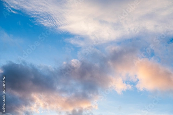 Fototapeta Clouds near sunset before rain blue sky