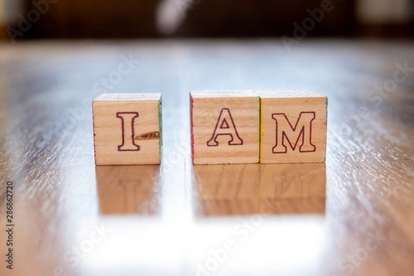Obraz "i am" written with wooden cubes