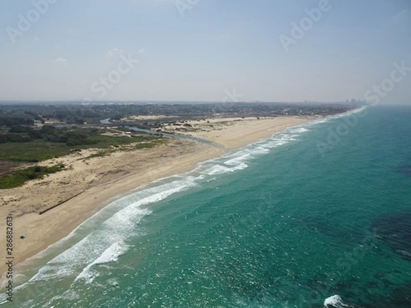 Obraz River flowing into the ocean