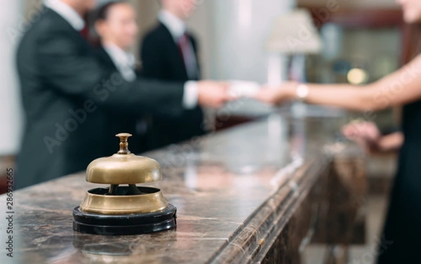 Fototapeta Picture of guests getting key card in hotel.